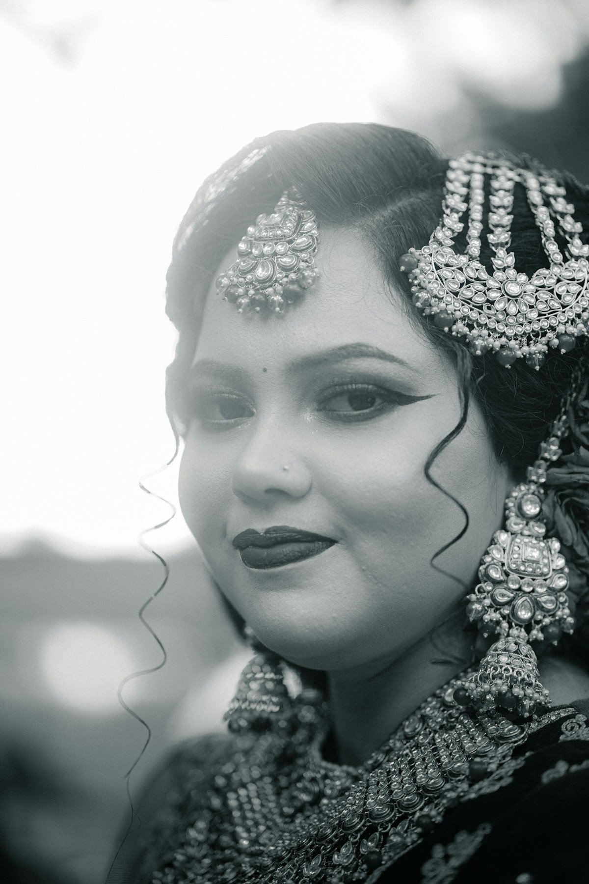 An Indian bride wearing traditional jewellery and elegant makeup